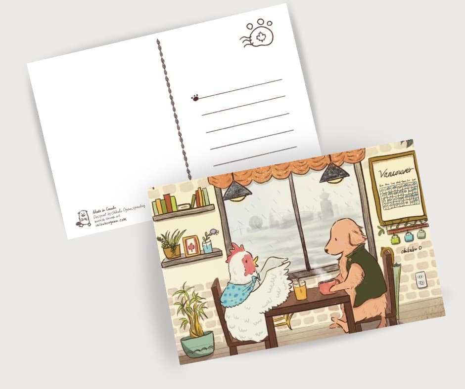 Two postcards: one that shows two animals in a cafe and the other one is flipped showing the writing lines