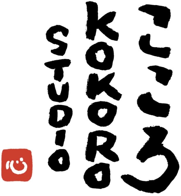 Studio Kokoro logo design with hand-brushed 'Studio Kokoro' lettering in English and the Japanese characters 'こころ' beside a red icon mark